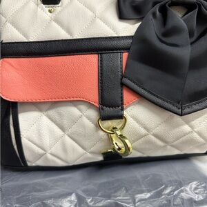 Betsy Johnson Elegant Black and White Quilted Handbag with Coral Accent